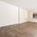 a living room area to kitchen